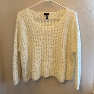 Fluffy soft cream colored sweater.